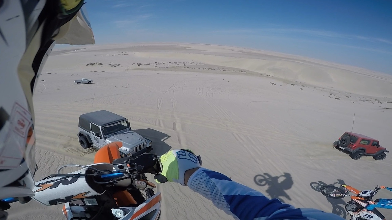 100ft Dirt bike dune jump landed onto Jeep Wrangler hood!